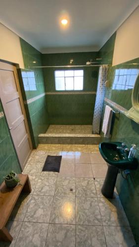 a bathroom with a sink and a shower at Templo de la Luna in Cusco