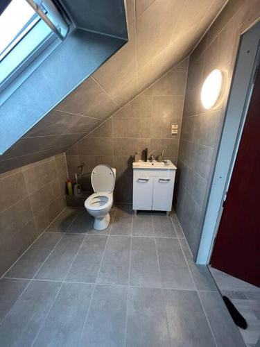 a bathroom with a toilet and a sink at Wohnung in Herford in Herford