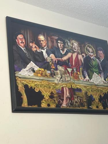 a painting of a group of people on a table at Casa Xochitepec in Mexico City