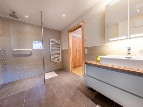 a bathroom with a sink and a shower at Chalet in Mittersill near Ski Slopes in Mittersill