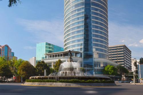 a building with a fountain in front of a building at The St. Regis Mexico City in Mexico City