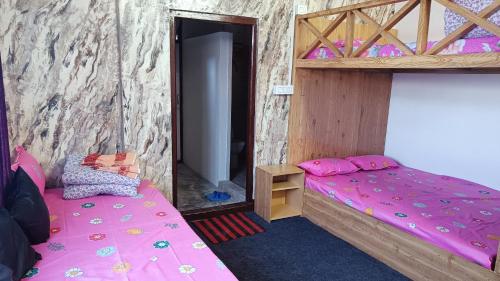 Łóżko lub łóżka w pokoju w obiekcie Tea corner Guest house