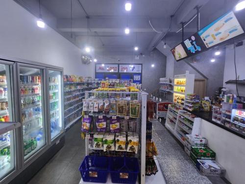 a store aisle of a grocery store with drinks and food at Lana Inn - Grand World Phú Quốc in Phu Quoc