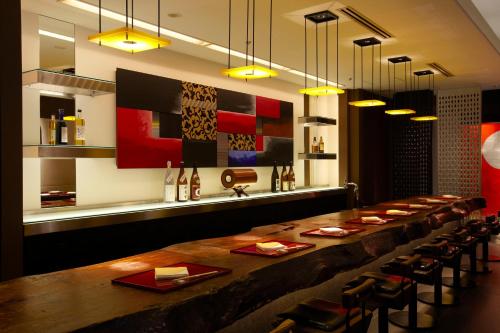 a long dining room with a long table and chairs at Hotel New Otani Tokyo Garden Tower in Tokyo