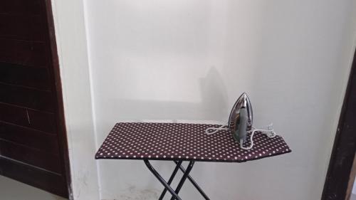 a phone sitting on a table in a room at Neny's Homestay in Saba
