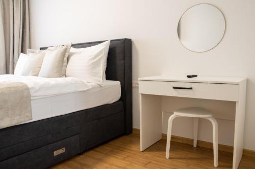 Ένα ή περισσότερα κρεβάτια σε δωμάτιο στο Hugo apartments
