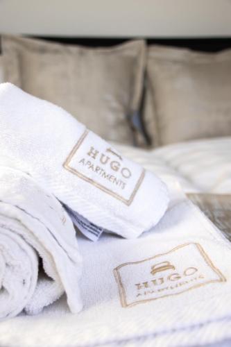 Ένα ή περισσότερα κρεβάτια σε δωμάτιο στο Hugo apartments