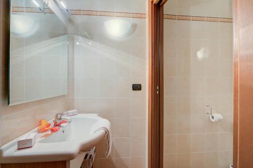 a bathroom with a sink and a shower at L' Aquila Campo Smith On The Ski Slopes - Happy Rentals in Bardonecchia