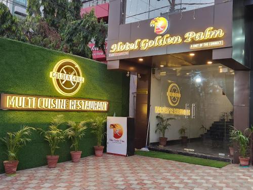 a store front of akriti golden palani cuisine restaurant at Hotel Golden Palm in Patna