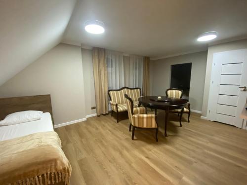Postel nebo postele na pokoji v ubytování Hotel Kamil