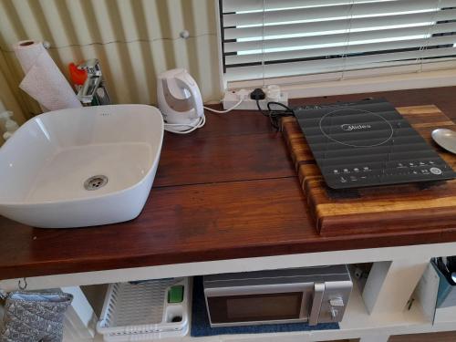 a counter top with a sink and a sink at Barnard Self Catering Apartments in St Francis Bay