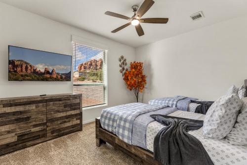 a bedroom with two beds and a ceiling fan at Andante Trail - Unit A - Red Rock Retreat in Sedona