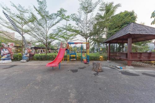 a playground with a slide and a gazebo at Urbanview Hotel Khayrizsan Tasikmalaya by RedDoorz in Tasikmalaya