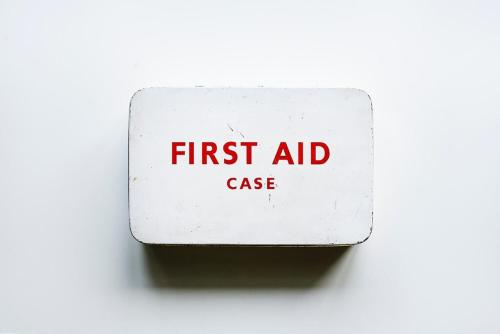a first aid sign with the words first aid case at HARIDHAM GUEST HOUSE in Vrindāvan