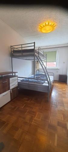 a room with two bunk beds and a light at Ferienwohnung Schuur - Harz in Hasselfelde
