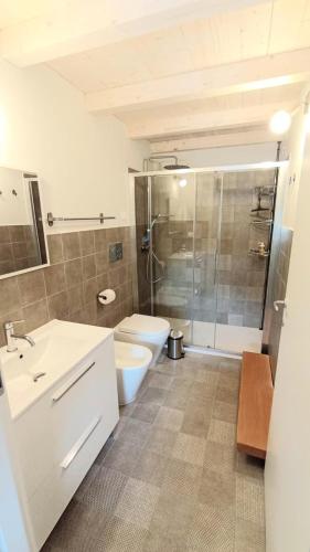 a bathroom with a toilet and a sink and a shower at Caterina e l'Indaco in Sarzana