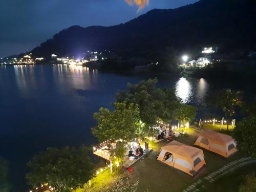 an aerial view of a lake at night at Nhà trên cây in Hanoi