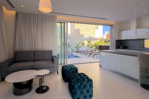 a living room with a couch and a table at City Napa Seaview Villas - Villa 8 in Ayia Napa