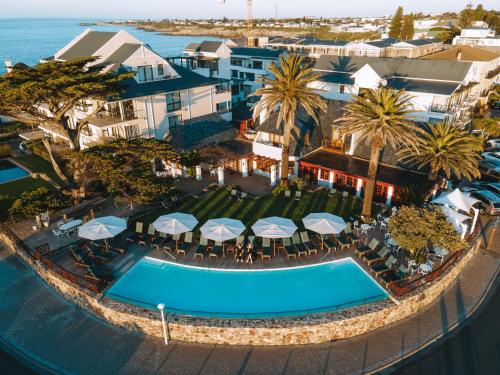 an aerial view of a resort with a swimming pool at Harbour House Hotel in Hermanus