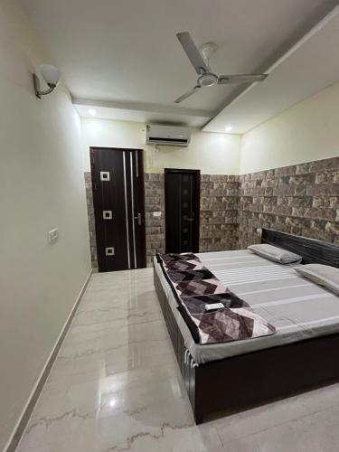 a bedroom with a large bed in a room at HareKrishna’s in Kharar