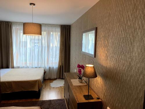 Postel nebo postele na pokoji v ubytování Arber Resort & Wellness Šumava