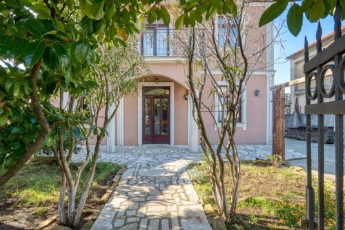 a house with a stone walkway leading to a door at Tivat Star in Tivat