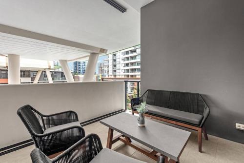 a living room with a couch and chairs and a table at South Bank Sensational! ~ 1Bed,1Bath,1Car,Balcony in Brisbane