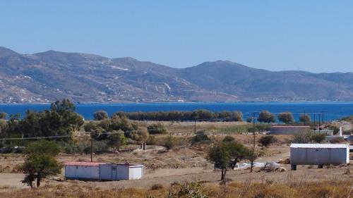 a view of a large body of water with mountains at Camping.Karystos Melodia in Karistos
