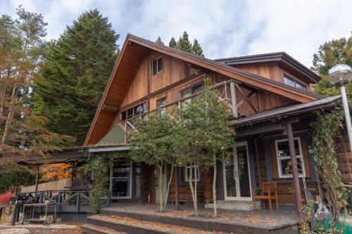 a wooden house with a gambrel roof at Secret Heaven in Yamanakako