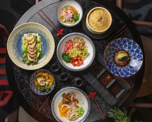 a table full of plates of food on a table at Emily Resort in Lviv