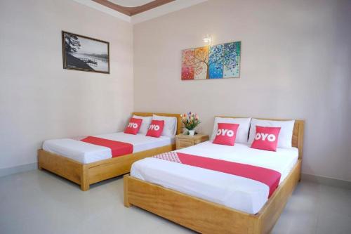 Ένα ή περισσότερα κρεβάτια σε δωμάτιο στο OYO 75359 Thaiburi Thara Resort