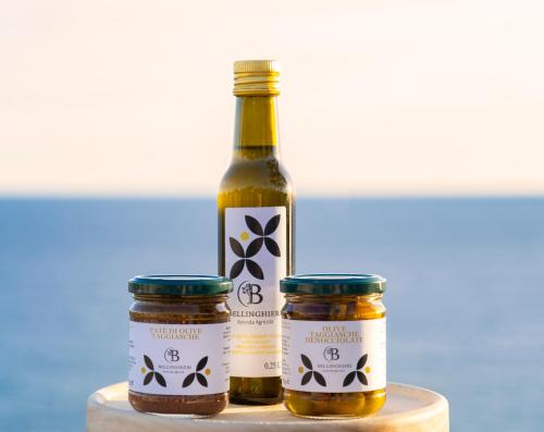 two bottles of honey sitting on a table at casa Ciapin in Cipressa