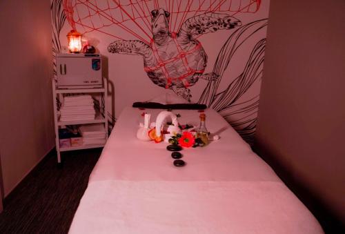 a room with a bed with a table with food on it at Radisson RED Dubai Silicon Oasis in Dubai