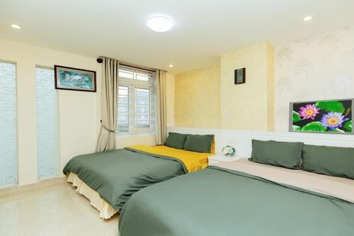 Postel nebo postele na pokoji v ubytování Vietnam Hotel Dalat