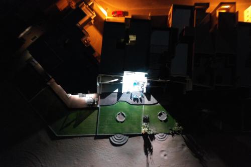 an overhead view of a glass table in a dark room at Ocean Dream Beach Cottage in Swakopmund