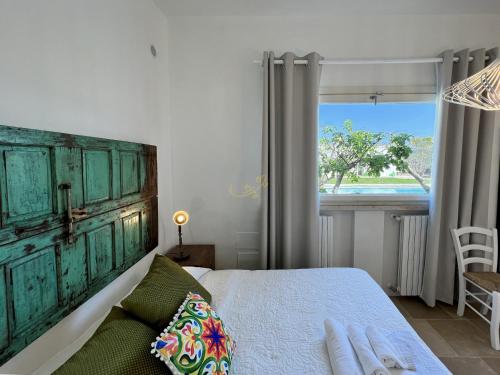 Postel nebo postele na pokoji v ubytování Trulli Dimore - Dimora del Giglio