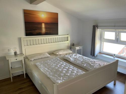 Postel nebo postele na pokoji v ubytování Wohnung Bö - Alte Schule