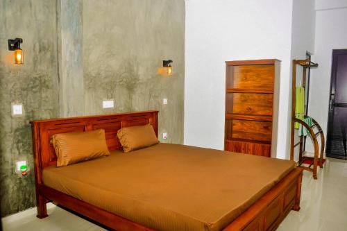Una cama o camas en una habitación de 2b1 weligama