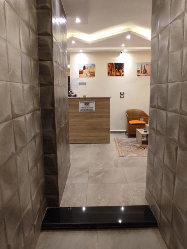 a lobby with a reception desk in a building at pyramids view suite/vista piramidi in Cairo