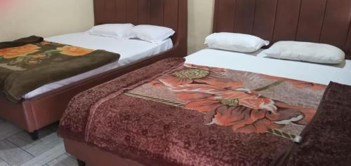 Katil atau katil-katil dalam bilik di Living Space Cottage