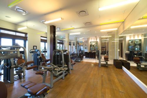 a gym with treadmills and cardio equipment in a building at Pezula Nature Retreat in Knysna