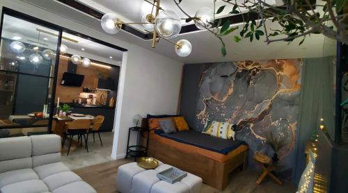 a bedroom with a bed and a living room at Apart-terrace on Baker Street in Lviv
