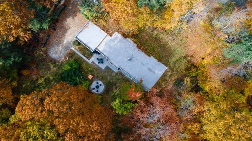 an overhead view of a building in a field at earthship forest exile 