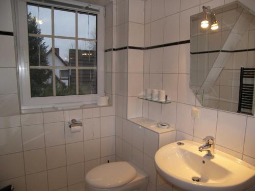 Bilik mandi di Ferienhaus 1A