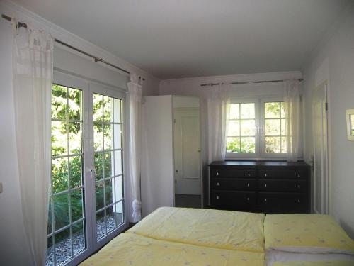 Katil atau katil-katil dalam bilik di Ferienhaus 1A