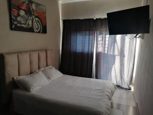Posteľ alebo postele v izbe v ubytovaní Cooper
