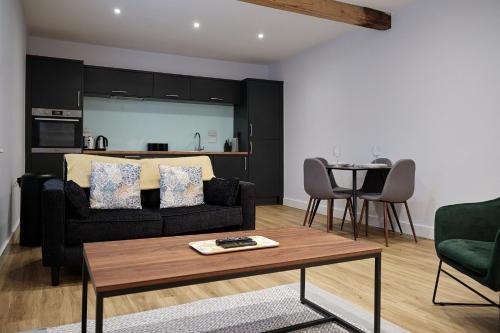 a living room with a couch and a table at 7 Cannon Street in Preston