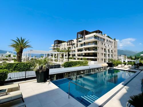 an image of a building with a swimming pool at MBroker - Porto Montenegro Elena residence apartments in Tivat