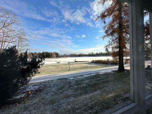 a view from a window of a road with snow at Kernu Manor Hotel & SPA in Kernu