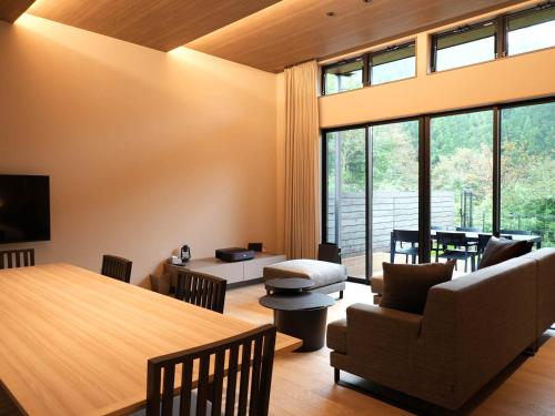 a living room with a couch and a table at Rakuten STAY VILLA Nikko in Nikko